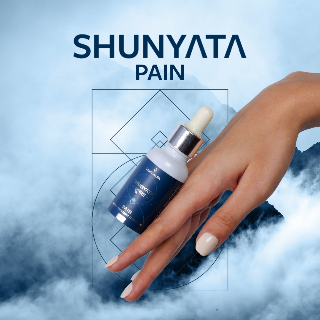 A model's hand showing the bottle of Shunyata Pain gliding down.