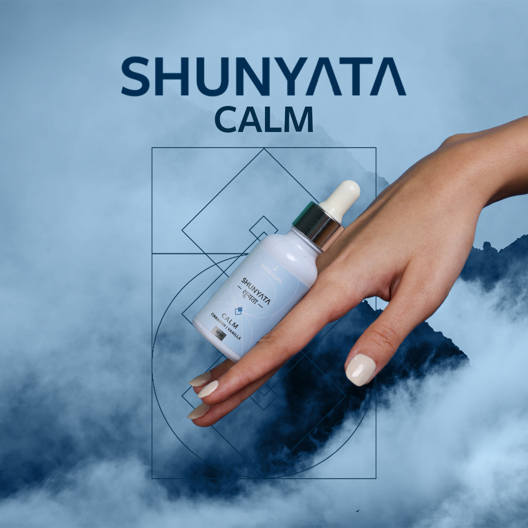 A model's hand showing the bottle of Shunyata Calm gliding down.
