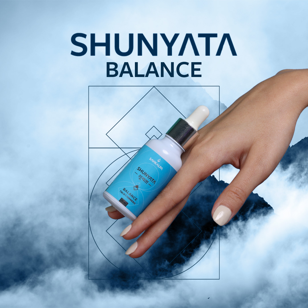 A model's hand showing the bottle of Shunyata Balance gliding down.