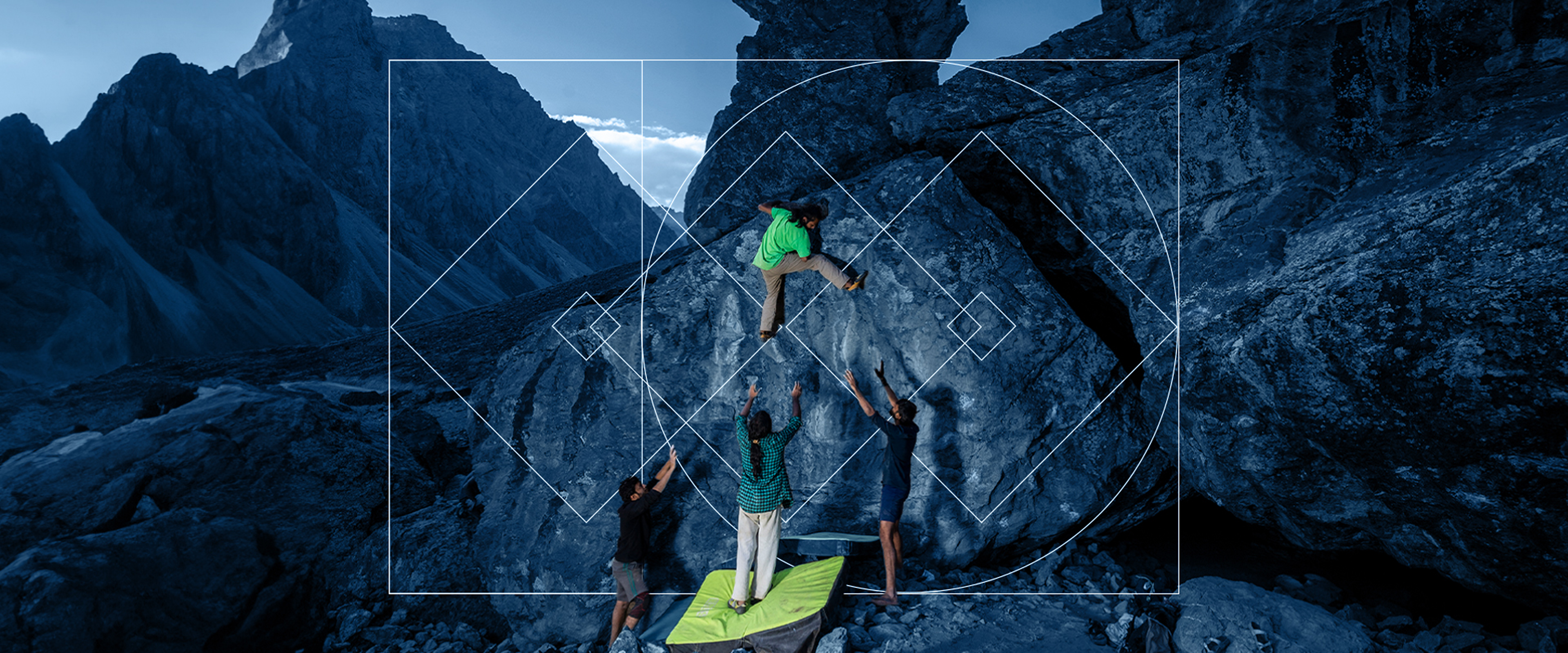 People climbing with a backdrop of mountains and savikalpa brand map