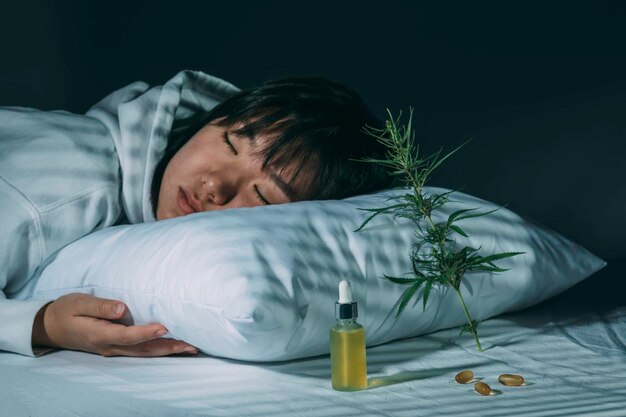 A woman sleeping peacefully with herbal medicine in the frame as well