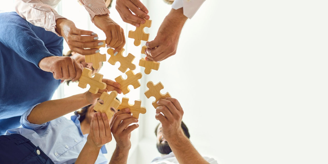 An image of people showing puzzle piece, expressing community building