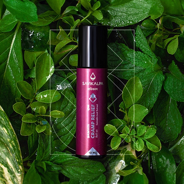 Shunyata cramp relief roll on product image with a backgrop of green leaves