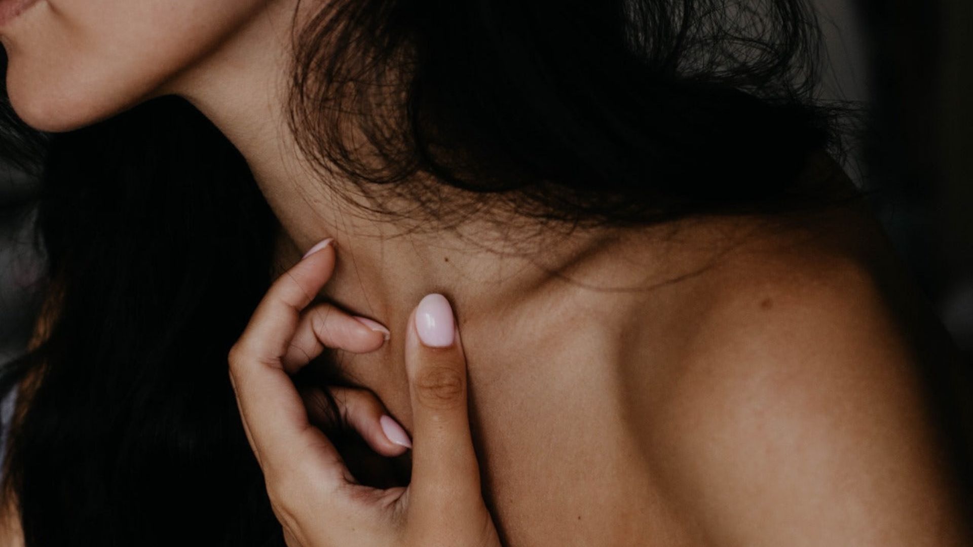 A woman with long black hair conveying a moment of reflection or emotion for effects of cannabinoids on our body