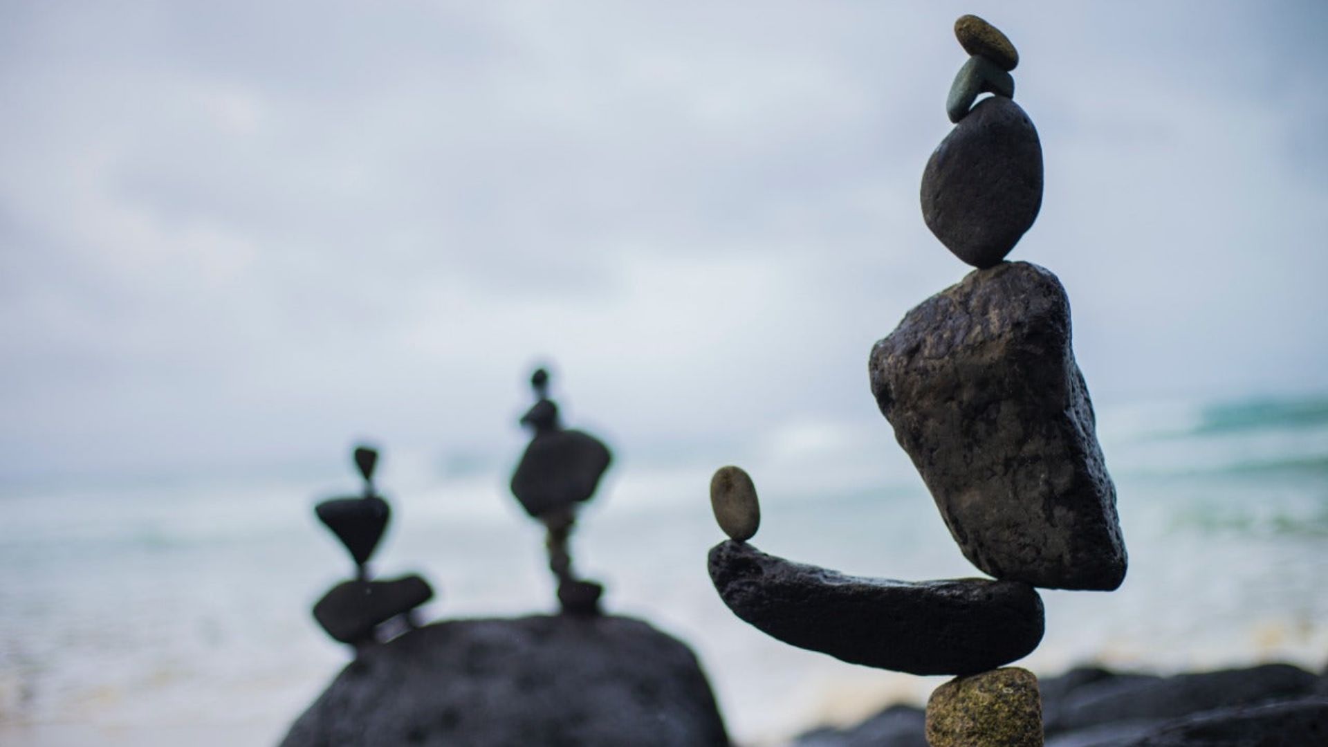 A carefully balanced arrangement of rocks, representing equilibrium in nature, linked to homeostasis and ECS