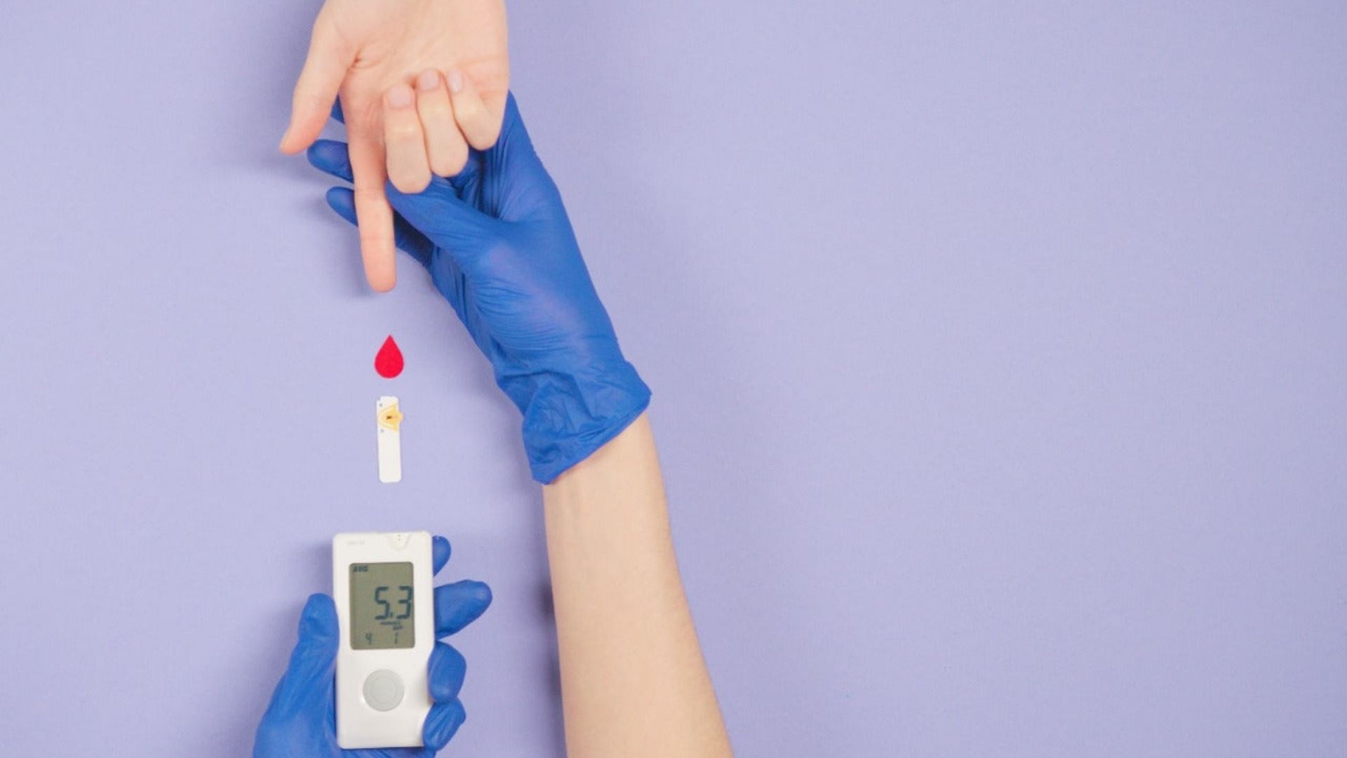 A close-up of two gloved hands holding a thermometer, representing health assessment for cannabis and Type 2 diabetes